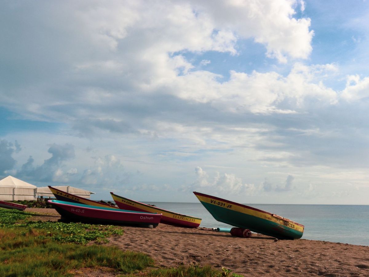 Fishing boats pulled up on a Caribbean beach